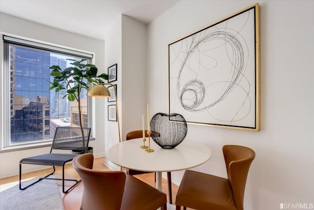 dining area featuring baseboards