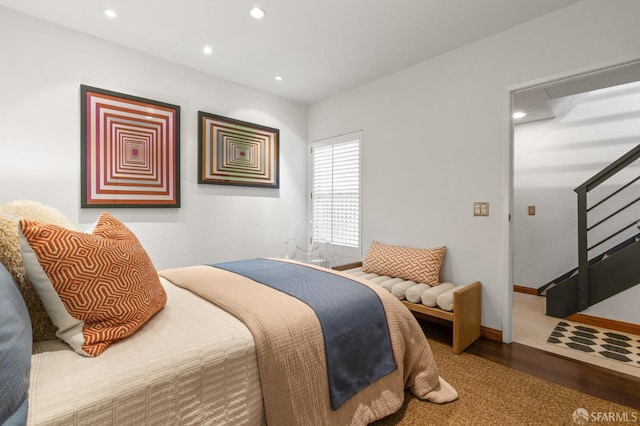 bedroom with hardwood / wood-style floors