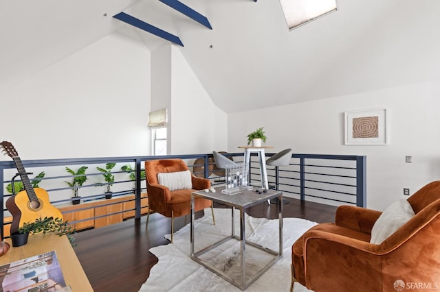 sitting room with wood-type flooring and vaulted ceiling