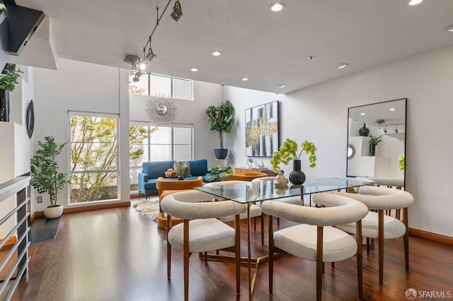 dining area with dark wood-type flooring