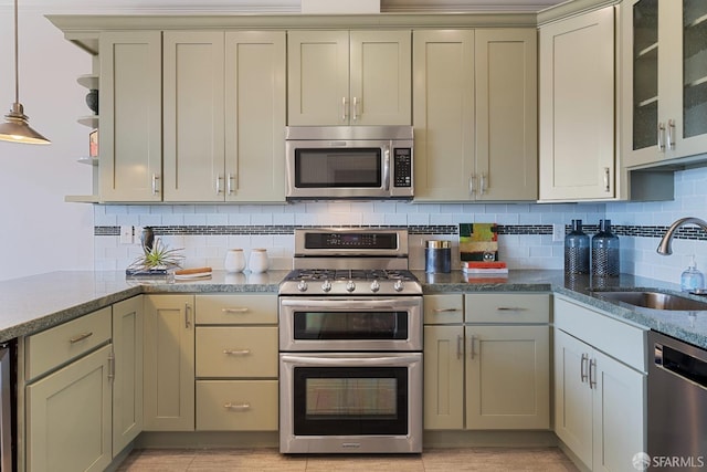 987 De Haro St Unit 1, San Francisco, CA 94107 - kitchen with appliances with stainless steel finishes, a sink, tasteful backsplash, light stone countertops, and open shelves