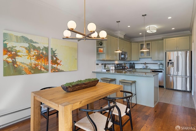 987 De Haro St Unit 1, San Francisco, CA 94107 - kitchen featuring appliances with stainless steel finishes, baseboard heating, ornamental molding, a chandelier, and glass insert cabinets
