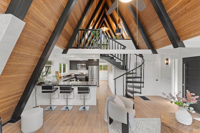 60 Piper Ln, Fairfax, CA 94930 - dining room with light wood-style floors, beamed ceiling, wood ceiling, high vaulted ceiling, and stairway