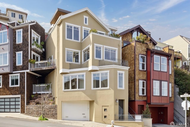 view of front facade featuring stucco siding and a garage