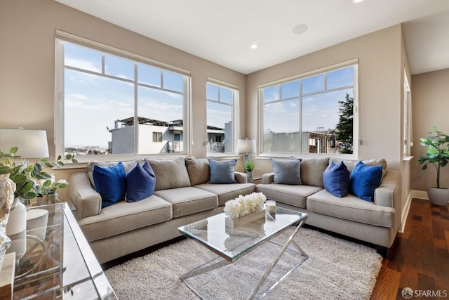 living room with a wealth of natural light, baseboards, wood finished floors, and recessed lighting