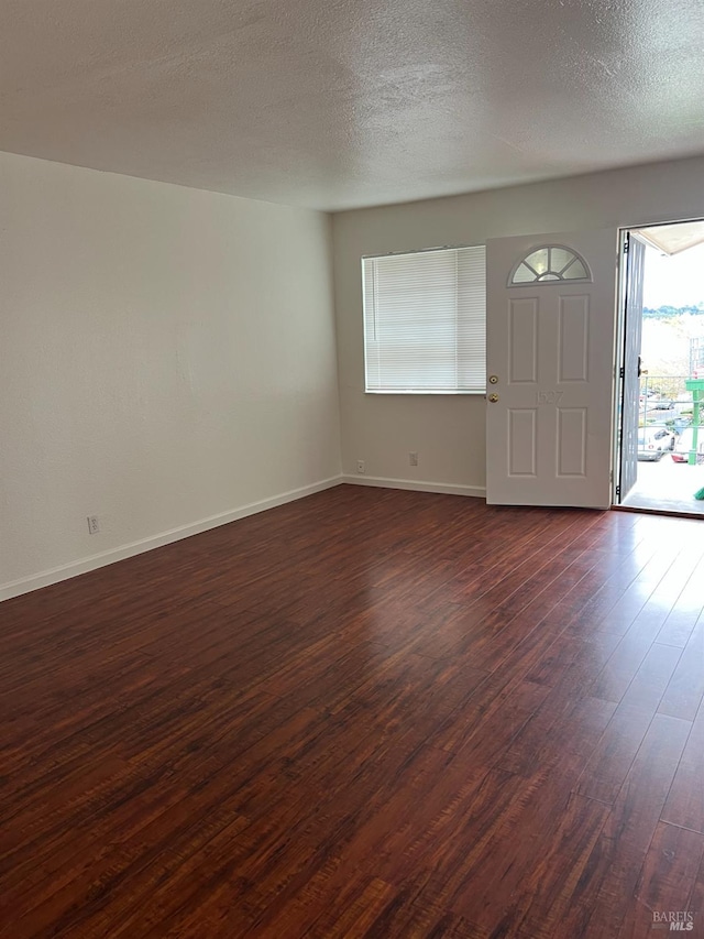1521-1527 Valle Vista Ave, Vallejo, CA 94589 - foyer entrance with dark wood-type flooring, baseboards, and a textured ceiling