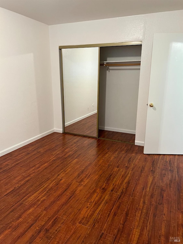 1521-1527 Valle Vista Ave, Vallejo, CA 94589 - unfurnished bedroom featuring wood finished floors, a closet, and baseboards