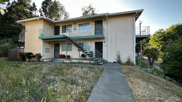 1521-1527 Valle Vista Ave, Vallejo, CA 94589 - view of property featuring stairs, stucco siding, and a balcony