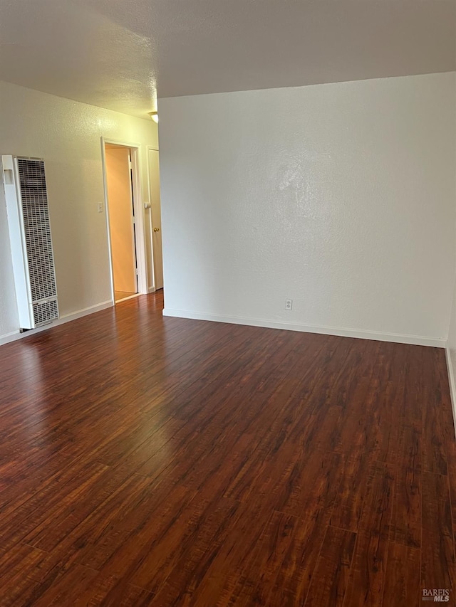 1521-1527 Valle Vista Ave, Vallejo, CA 94589 - empty room with a heating unit, dark wood finished floors, and baseboards