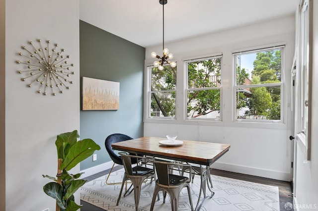 dining space featuring a chandelier and light hardwood / wood-style flooring