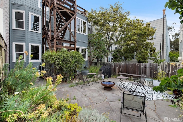 view of patio / terrace featuring a fire pit