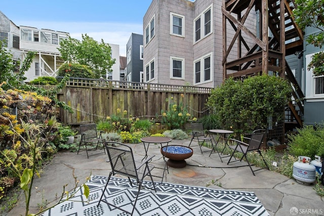 view of patio / terrace featuring an outdoor fire pit