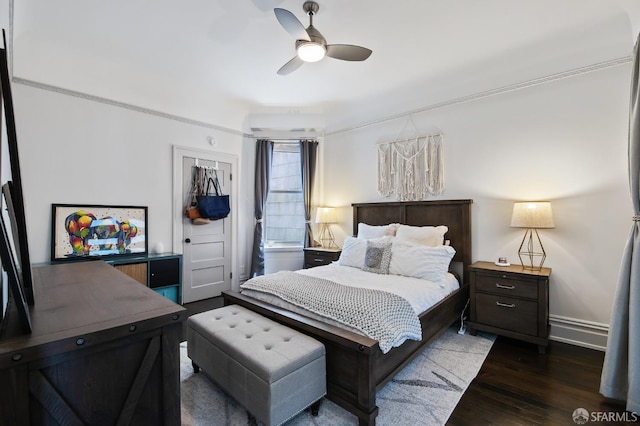 bedroom featuring dark hardwood / wood-style flooring, a closet, and ceiling fan