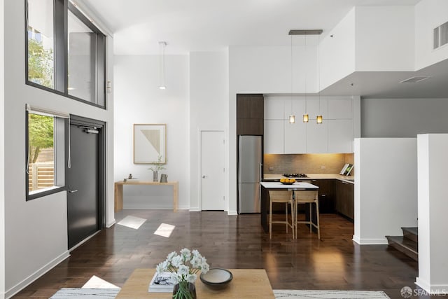 1788 Clay St Unit 103, San Francisco, CA 94109 - living room with a towering ceiling, stairway, dark wood-style floors, and baseboards