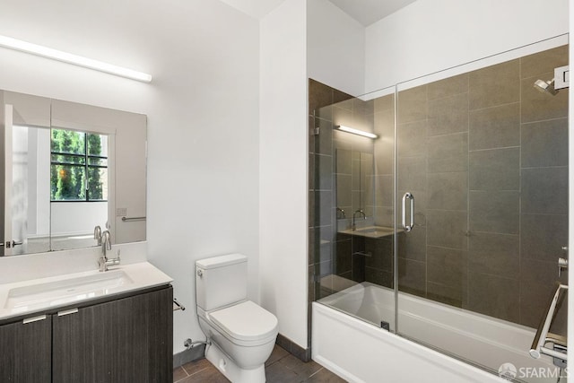 1788 Clay St Unit 103, San Francisco, CA 94109 - bathroom featuring toilet, vanity, shower / bath combination with glass door, tile patterned flooring, and baseboards