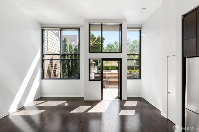 1788 Clay St Unit 103, San Francisco, CA 94109 - entryway featuring dark wood-style floors, expansive windows, and baseboards