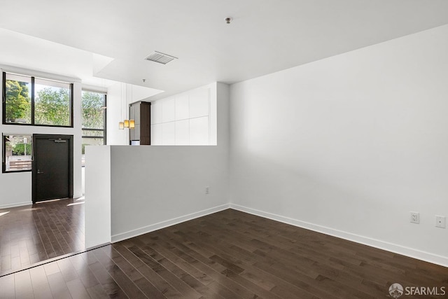 1788 Clay St Unit 103, San Francisco, CA 94109 - empty room with dark wood-style flooring, baseboards, and a pendent fire sprinkler