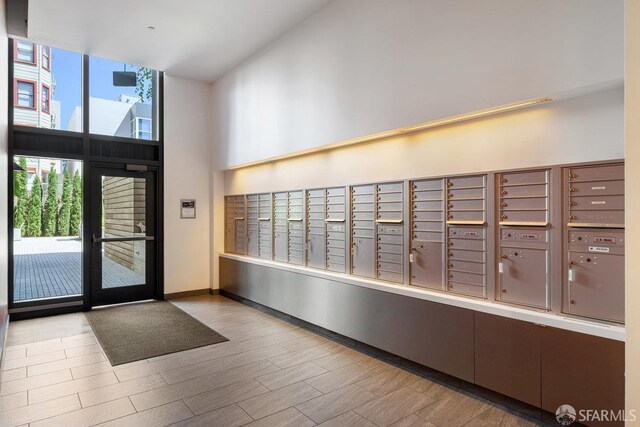1788 Clay St Unit 103, San Francisco, CA 94109 - surrounding community featuring mail area, a towering ceiling, and a wall of windows