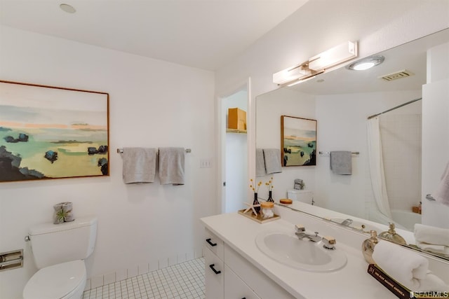 full bathroom featuring tile patterned floors, shower / bathtub combination with curtain, vanity, and toilet