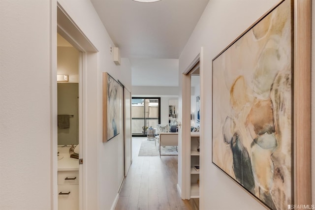 hall with light hardwood / wood-style flooring