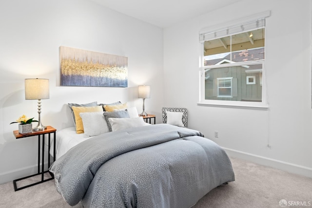 bedroom featuring baseboards and carpet floors