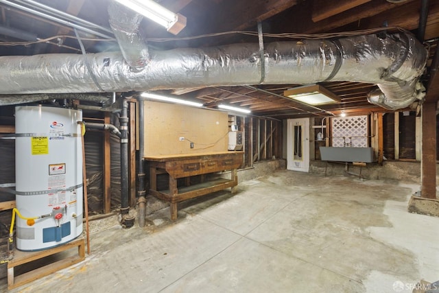47 Brunswick St, San Francisco, CA 94112 - unfinished basement featuring water heater and a workshop area