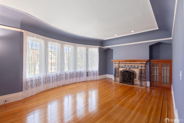 47 Brunswick St, San Francisco, CA 94112 - unfurnished living room with baseboards, a brick fireplace, and wood finished floors