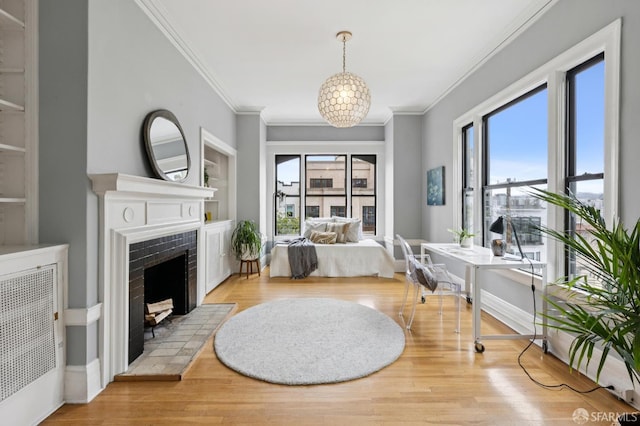 1250 Vallejo St Unit 1, San Francisco, CA 94109 - bedroom with crown molding, multiple windows, wood finished floors, and a tile fireplace
