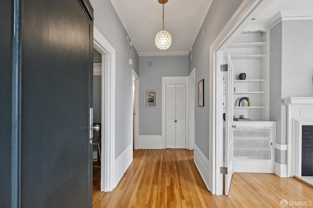 1250 Vallejo St Unit 1, San Francisco, CA 94109 - hall featuring light wood finished floors, ornamental molding, and built in shelves