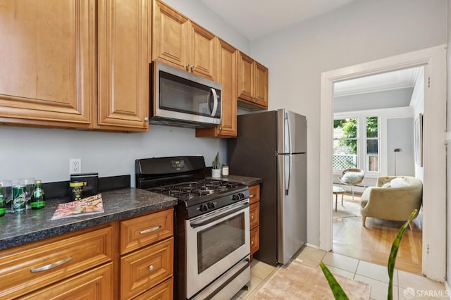1250 Vallejo St Unit 1, San Francisco, CA 94109 - kitchen with appliances with stainless steel finishes, light tile patterned flooring, brown cabinetry, ornamental molding, and a baseboard heating unit