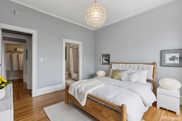 1250 Vallejo St Unit 1, San Francisco, CA 94109 - bedroom with ornamental molding, wood finished floors, and connected bathroom
