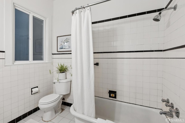 1250 Vallejo St Unit 1, San Francisco, CA 94109 - bathroom featuring shower / bathtub combination with curtain, tile walls, and tile patterned flooring