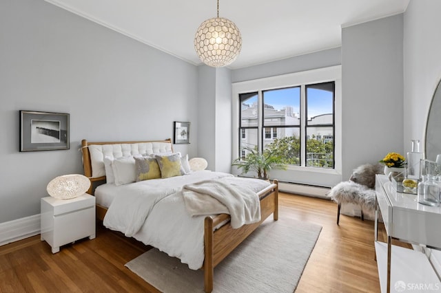 1250 Vallejo St Unit 1, San Francisco, CA 94109 - bedroom with baseboard heating, wood finished floors, and ornamental molding