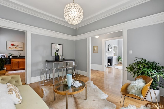 1250 Vallejo St Unit 1, San Francisco, CA 94109 - living area with light wood-style floors, a fireplace, and ornamental molding