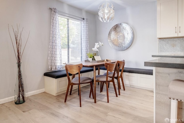 dining space featuring light wood-type flooring