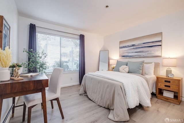 bedroom featuring light wood-type flooring