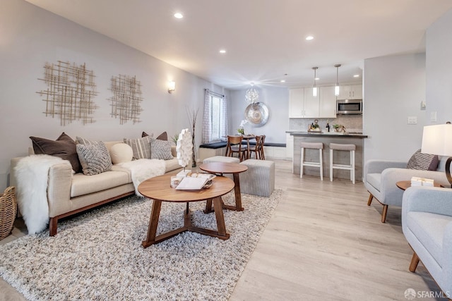 living room with light hardwood / wood-style floors