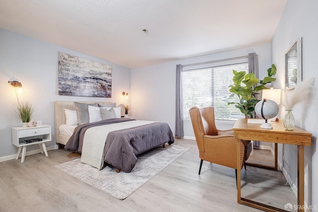 bedroom with light wood-type flooring