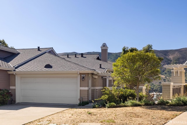 townhome / multi-family property featuring stucco siding, concrete driveway, and an attached garage
