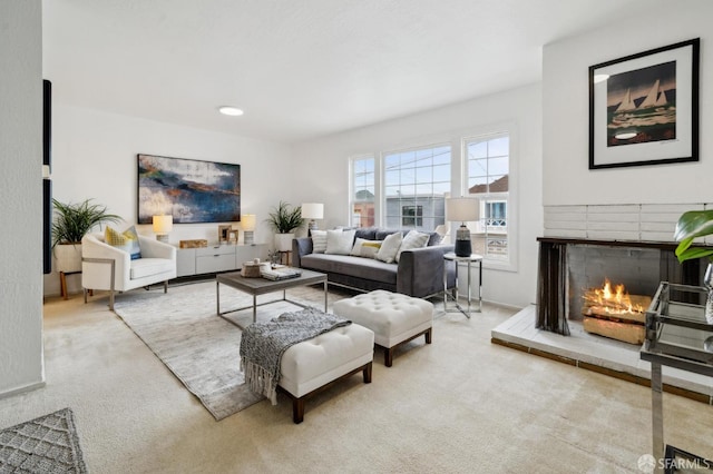 living room with light carpet and a brick fireplace