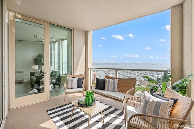 balcony featuring a water view