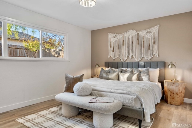 bedroom with hardwood / wood-style flooring