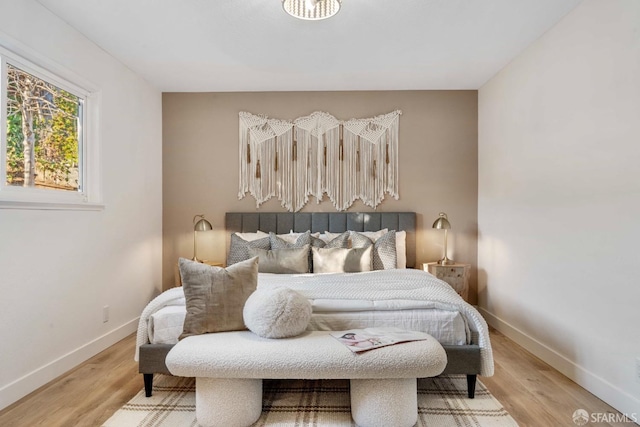 bedroom with wood-type flooring