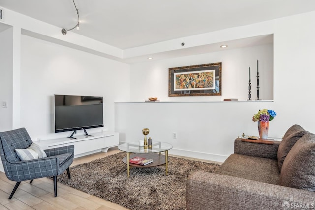 229 Brannan St Unit 11J, San Francisco, CA 94107 - living area featuring recessed lighting, wood finished floors, and rail lighting