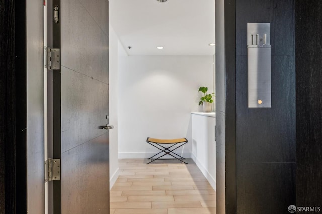 229 Brannan St Unit 11J, San Francisco, CA 94107 - hall with wood finished floors, baseboards, and recessed lighting