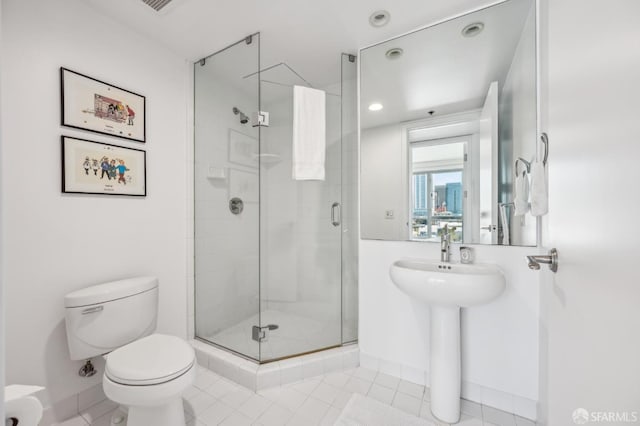 229 Brannan St Unit 11J, San Francisco, CA 94107 - full bath featuring toilet, tile patterned flooring, a shower stall, recessed lighting, and a sink