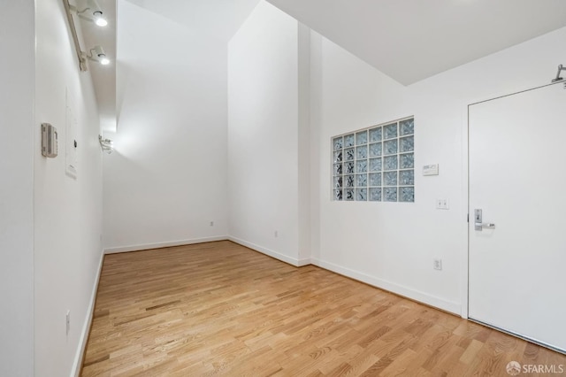 unfurnished room with light hardwood / wood-style flooring