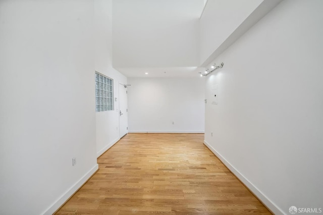 unfurnished room with light hardwood / wood-style flooring