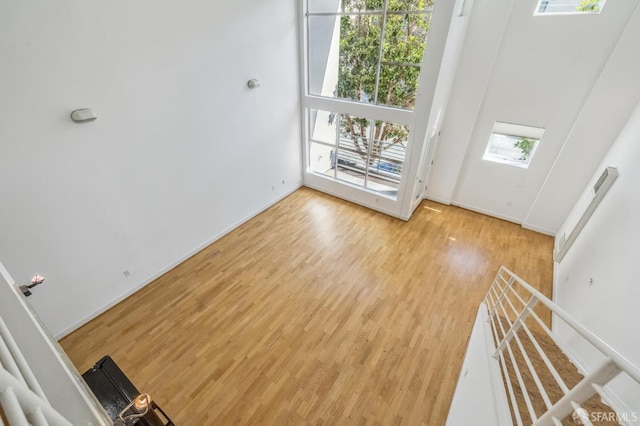 entrance foyer featuring light wood-type flooring and a high ceiling