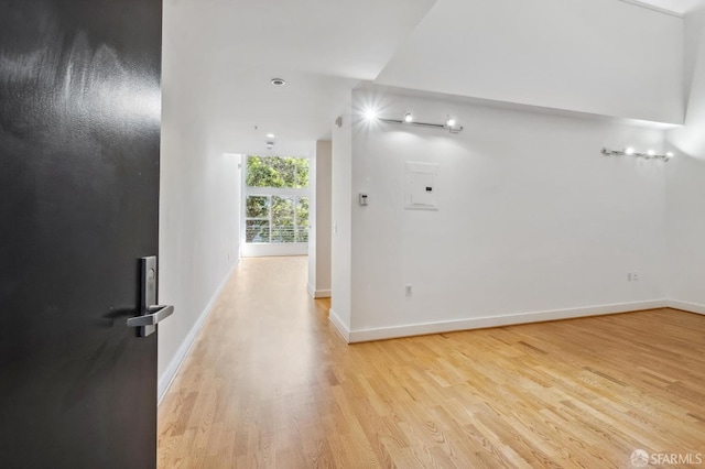 hall with light hardwood / wood-style flooring